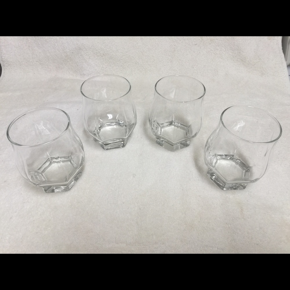 Four drinking glasses